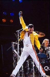 Freddie Mercury performing on stage