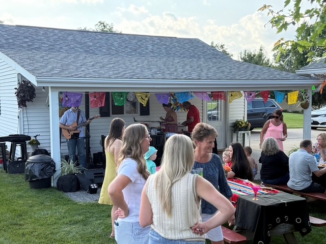 Tom Campbell performing at outdoor engagement party