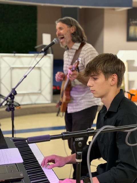 Amos and Tom performing live music together