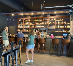 People enjoying drinks at a bar.